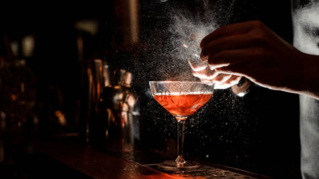 Mobile bar setup for wedding event with professional bartenders serving cocktails