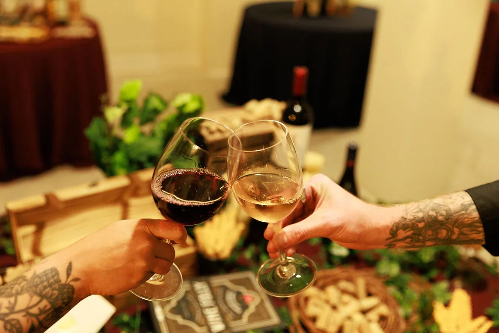 Guests toasting wine beside a Formosa Bar event setup