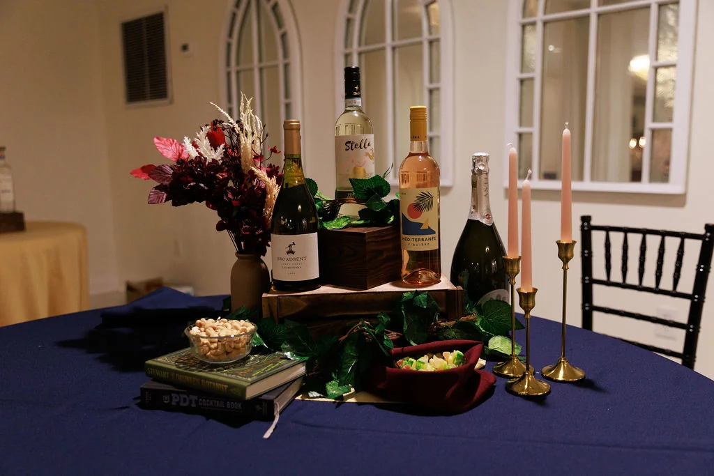 Corporate event mobile bar setup with wine, spirits, and decor