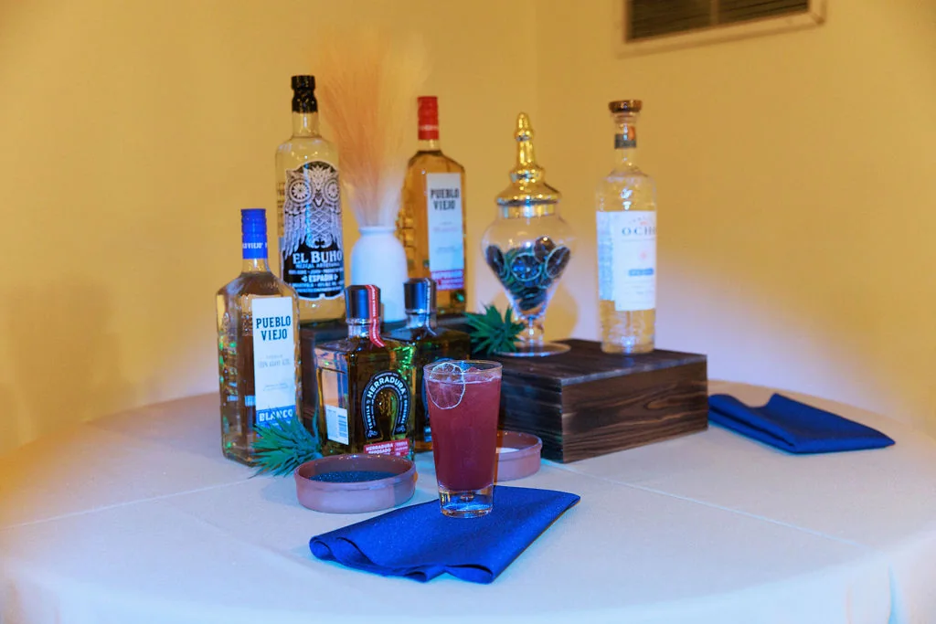 Custom red signature cocktail setup for a private event drink menu