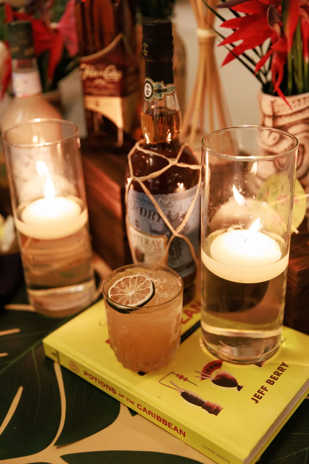 Candlelit cocktail detail from a private event bar setup