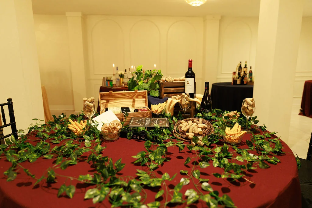 Formal fundraiser or gala table setup with wine and bar service details