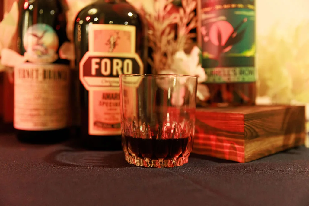 Nightcap experience cocktail with warm evening bar lighting