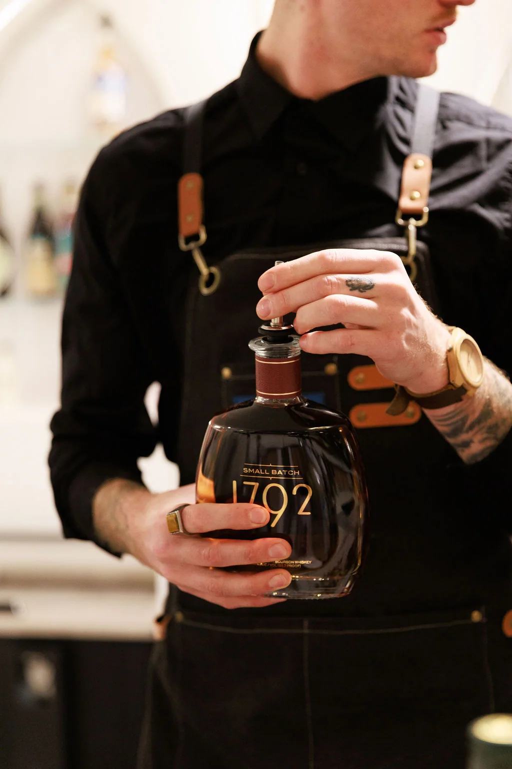 Professional Formosa Bar bartender preparing bottle service for an event