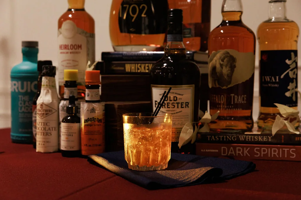 Whiskey reserve setup with old fashioned cocktail and premium spirits
